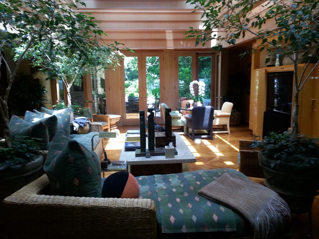 Indoor trees in a wood-paneled great room