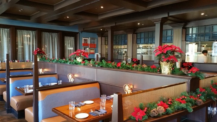 Holiday garlands through a restaurant dining room