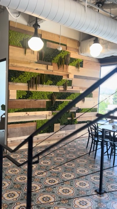 Preserved moss between reclaimed wood slats in a restaurant